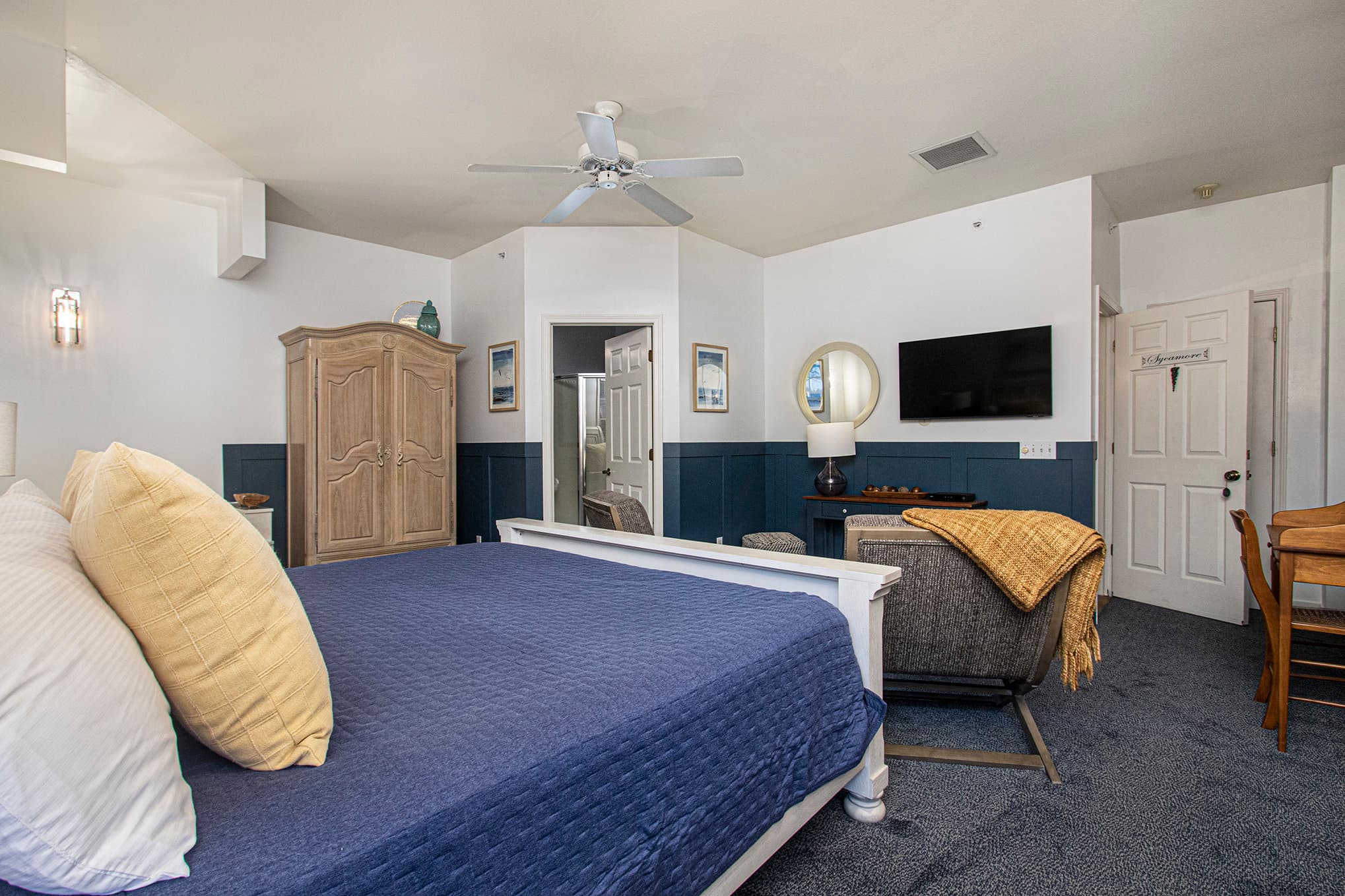 king sleigh bed two chairs flat screen TV