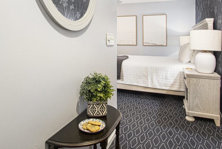 room entrance showing queen bed and fresh baked cookies